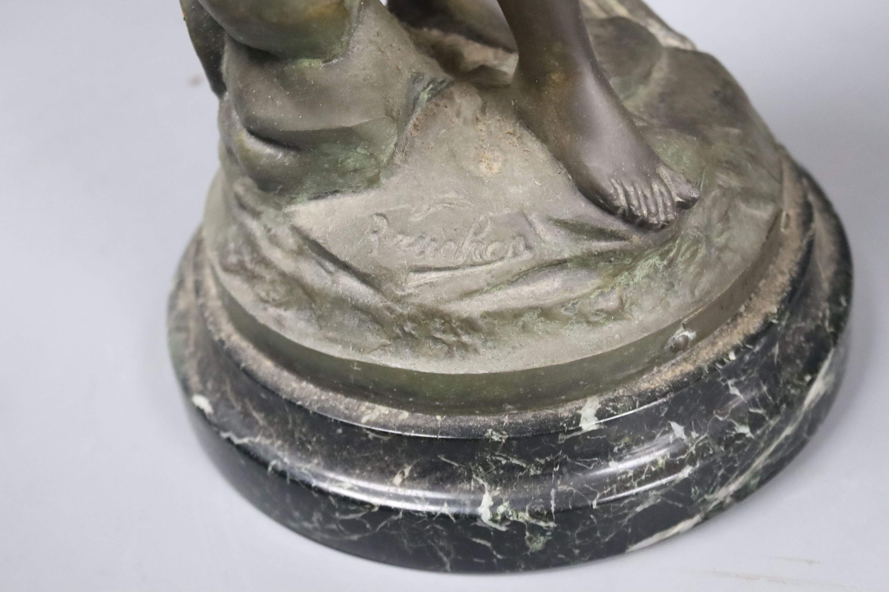An Art Nouveau spelter figural flame shaded table lamp,74 cms high.